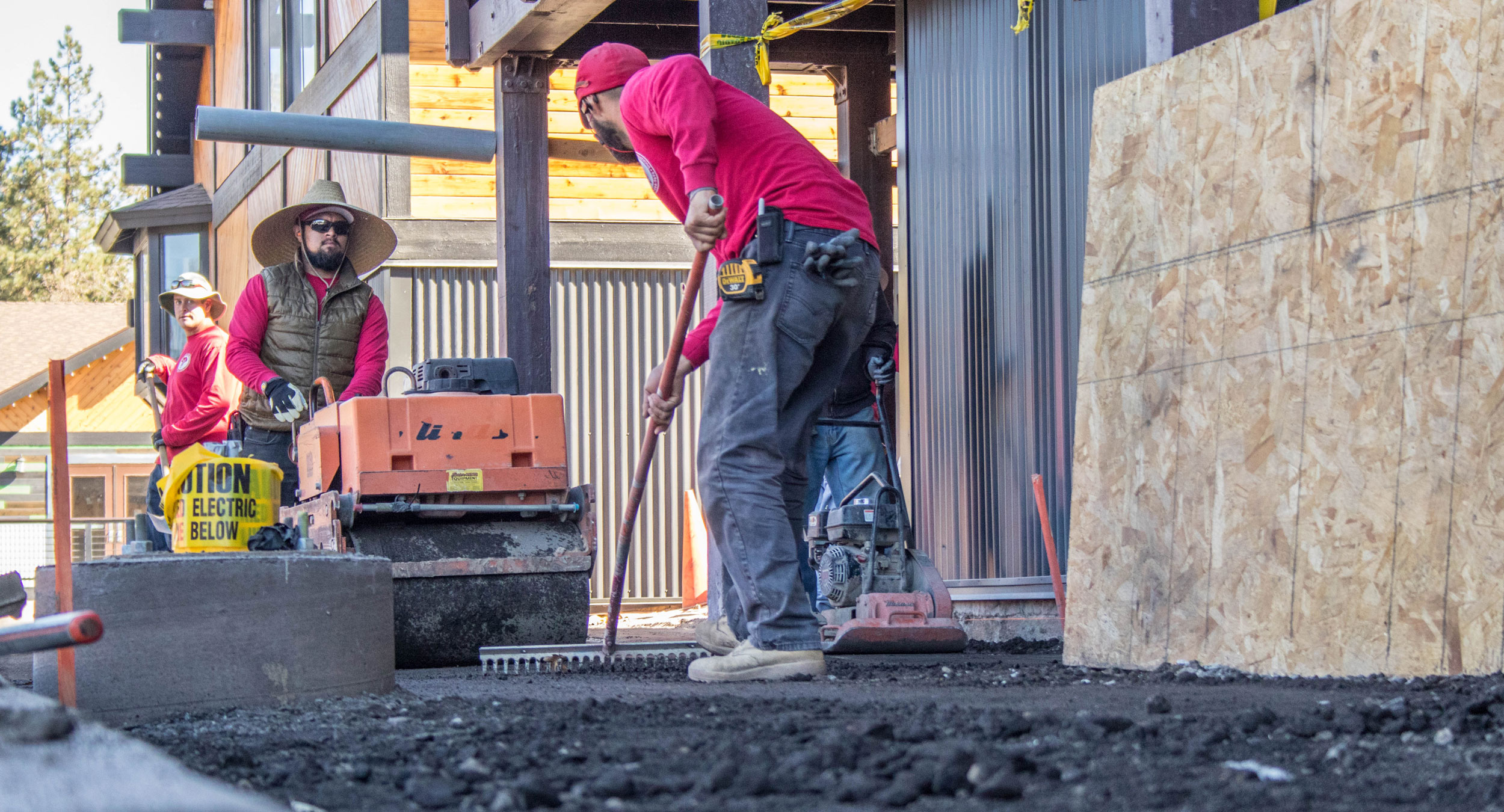 Construction workers working outdoors paving cement